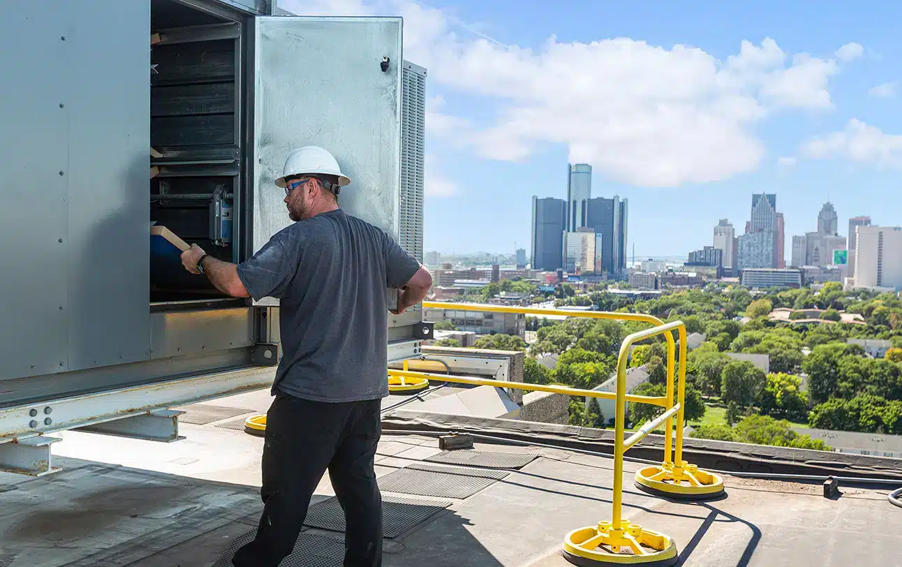 a man standing on a sidewalk